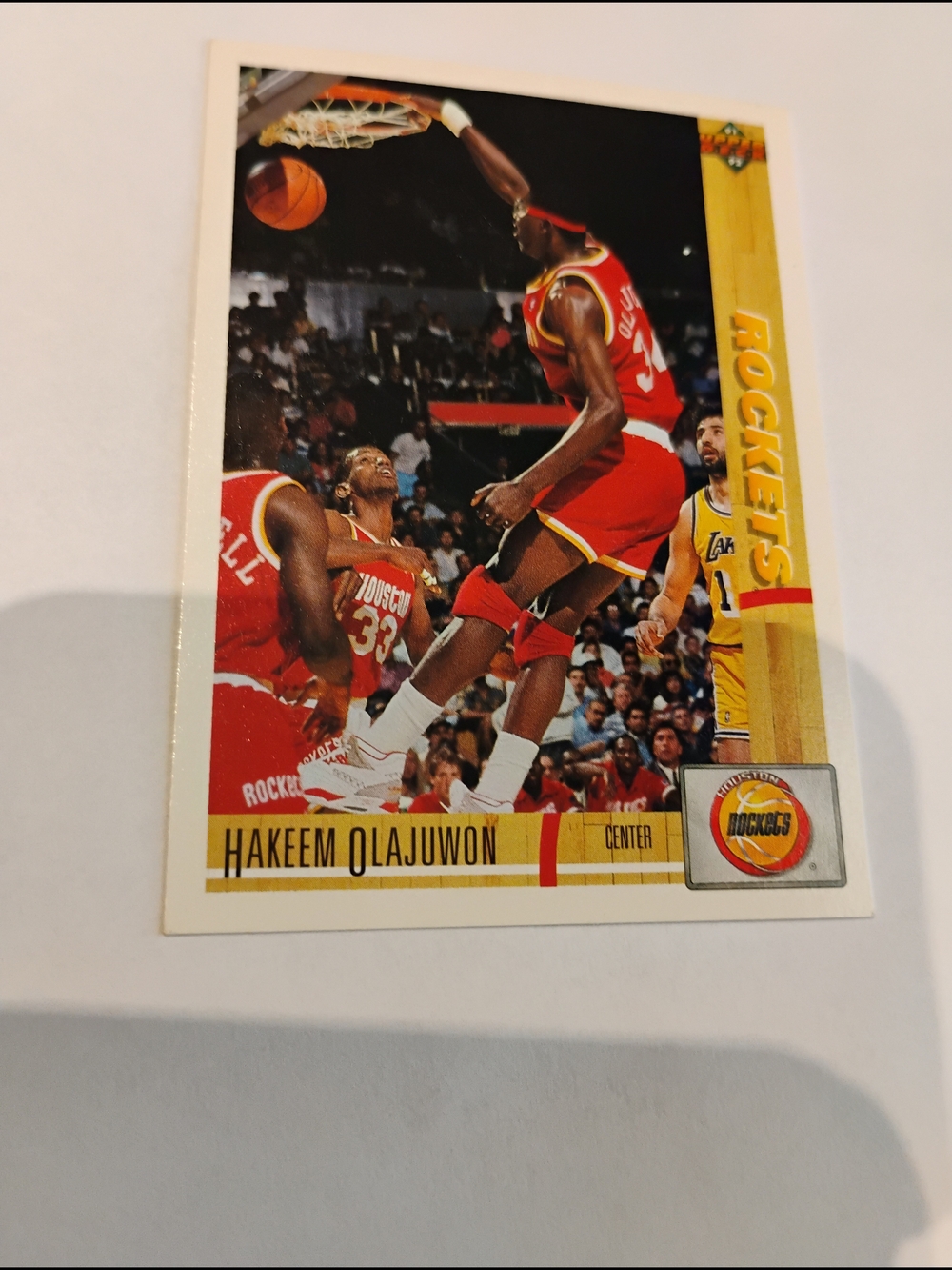 1991-92 Hakeem Olajuwon Houston Rockets Basketball Card - Red & Yellow